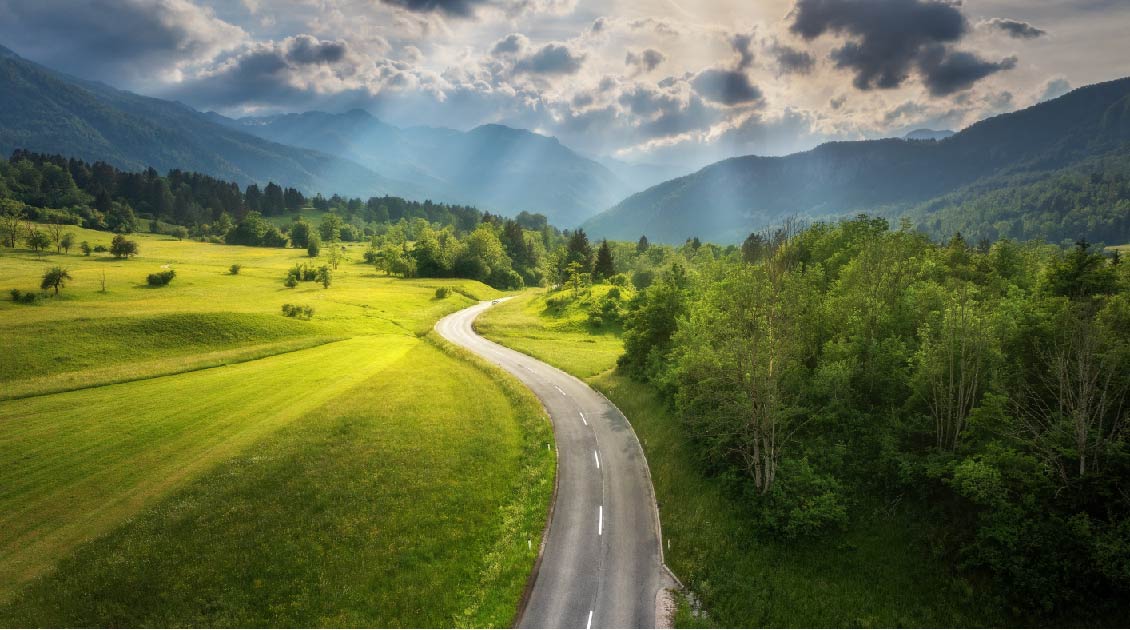 Image of a road with sunbeams shining